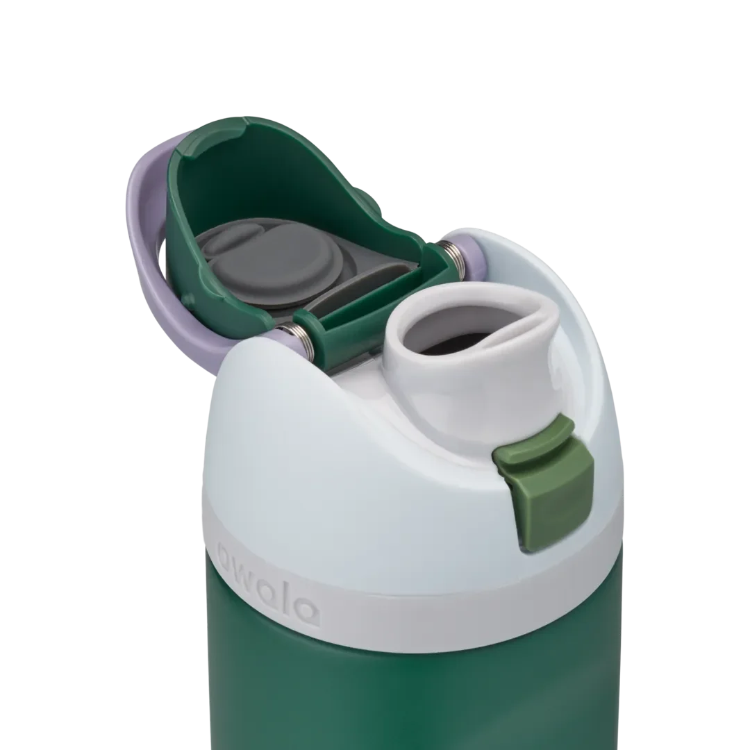 Owala FreeSip 24oz in Great Smoky Mountains, dark forest green insulated stainless steel bottle with white lid, lavender carry loop, dark green flip cap, and olive green push-button, lid open detail